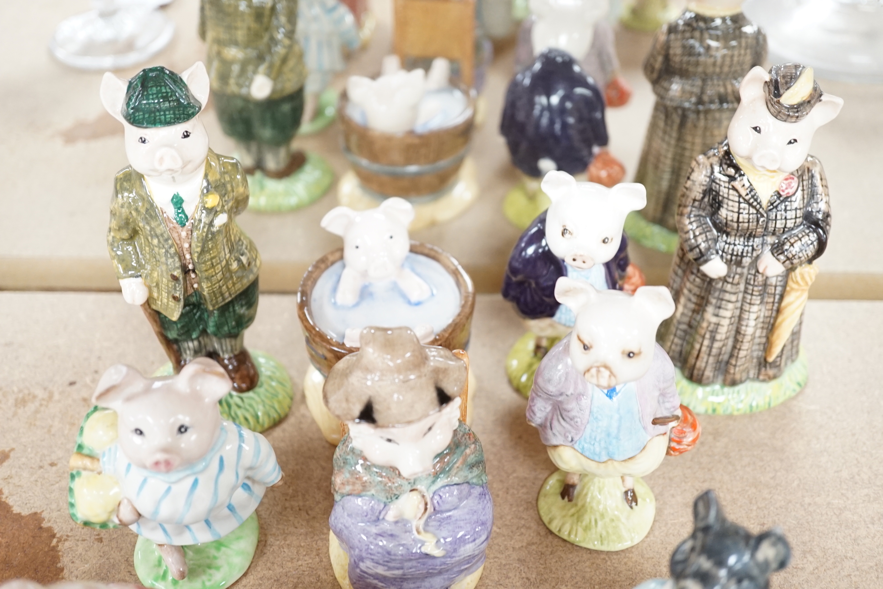Twelve Beswick Beatrix Potter character pigs